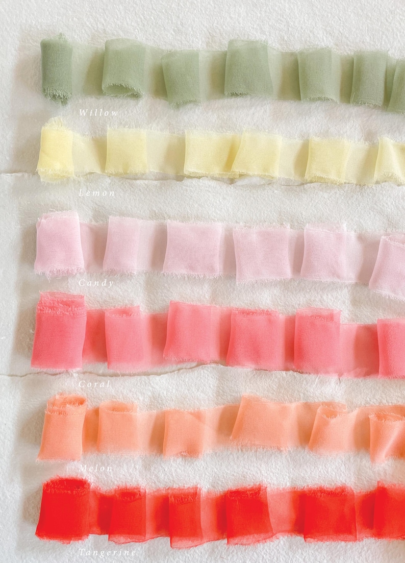 May include: Close-up of six rows of ruffled ribbon in various colours. The colours include willow, lemon, candy, coral, melon, and tangerine. The names of the colours are written below each row of ribbon.