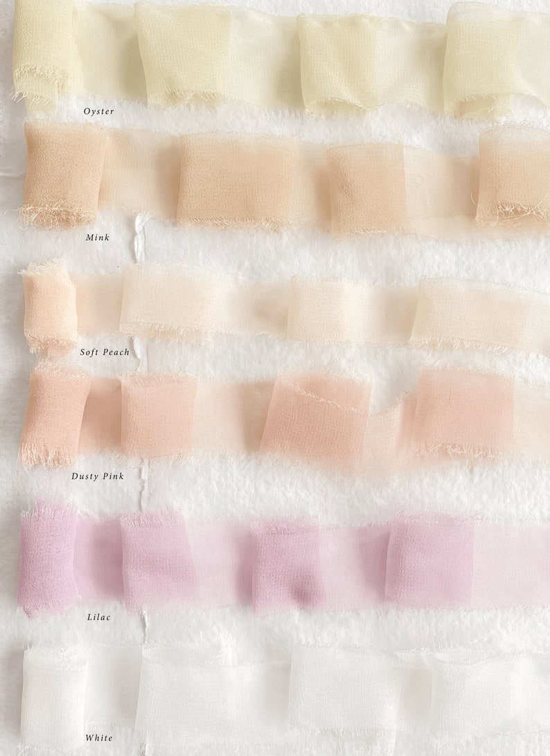 May include: Six samples of sheer ribbon in various shades of white, peach, pink, and lilac. The ribbon samples are labeled "Oyster", "Mink", "Soft Peach", "Dusty Pink", "Lilac", and "White".