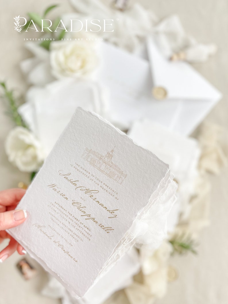 May include: A white wedding invitation with gold lettering. The invitation announces the marriage of Sasha Hernandez and Warren Chiapparelli on Saturday, April 1st, 2023 at 2:00 PM at Parroquia Santiago Apostol in Tequila, Jalisco, Mexico. The invitation includes a small illustration of a church.
