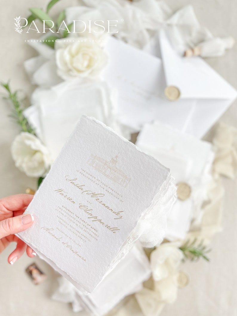 May include: White wedding invitation with gold lettering. The invitation reads "The honor of your presence is requested at the marriage of Sasha (Hernandez) and Warren Chiapparelli. Saturday, the first of April, five o'clock in the afternoon, Sand and Twenty Three, Krogia Bantiarg Apostol, Tequila, Jalisco Mexico. Reception to follow.  Cacanda et Drapenario."