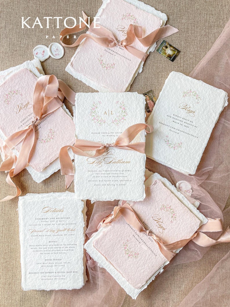 This exquisite handmade paper wedding invitations suite offers a blend of classic elegance and personalized artistry. Each bespoke invites set features a custom, hand-painted watercolor monogram of your initials, creating a unique and personal touch. The invitations are beautifully assembled with luxurious satin silk ribbons, adding a soft, opulent texture that your guests will adore.