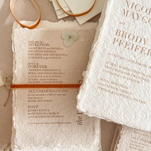 Wedding details and RSVP cards printed on textured handmade cotton paper with organic deckle edges as part of a fine art wedding invitation suite.