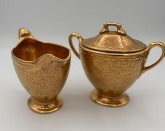 Wheeling Decorative Co Gold encrusted porcelain cream and sugar set