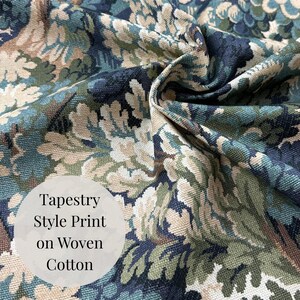 May include: Close-up of woven cotton fabric with a tapestry-style print. The design features a pattern of stylized leaves in shades of blue, green, and beige. The fabric has a textured appearance, with the words "Tapestry Style Print on Woven Cotton" in a white circle.
