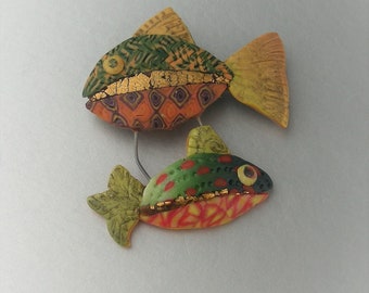 Happy Glowing Fish brooch in polymer clay