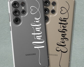 May include: Two clear phone cases with personalized names. The case on the left is gray with the name "Natalie" in white lettering. The case on the right is gold with the name "Elizabeth" in black lettering.
