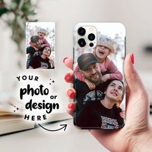 May include: A white phone case with a photo of a family of three. The photo shows a man, a woman, and a young girl. The man is wearing a black hat with the word "Youth" on it. The woman is wearing a black shirt with a leopard print design. The girl is wearing a white shirt and a straw hat. The photo is printed on the back of the phone case.
