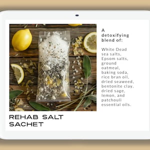 May include: A white plastic pouch filled with a detoxifying bath salt blend. The pouch is labeled "REHAB SALT SACHET". The ingredients include white dead sea salts, Epsom salts, ground oatmeal, baking soda, rice bran oil, dried seaweed, bentonite clay, dried sage, lemon, and patchouli essential oils.