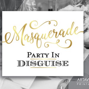 May include: A white printable sign with gold calligraphy that says "Masquerade Party in Disguise" and the text "Art Avenue Printables" in the bottom right corner.