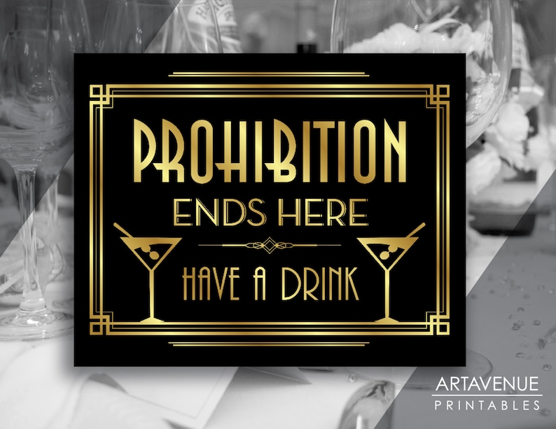 May include: Black and gold printable sign with the text "Prohibition Ends Here Have a Drink" in a decorative art deco font. Two martini glasses are on either side of the text.