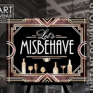 May include: A black and gold art deco style sign with the text "Let's Misbehave" in a white art deco font. The sign features a geometric pattern with gold and pink accents. There are also images of glasses, bottles, and a martini glass.