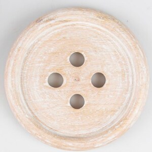 May include: A white wooden button with four holes. The button is round and has a raised edge.