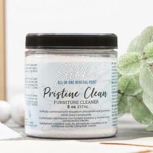 May include: A clear plastic jar with a black screw-top lid containing Silk All-In-One Mineral Paint Pristine Clean furniture cleaner. The label displays the product name, 8 oz 237mL volume, and text regarding trisodium phosphate and inert compounds.