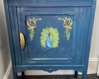 SOLD Peacock design side table, painted dark blue, pearlescent finish, gold accents, feather design handle
