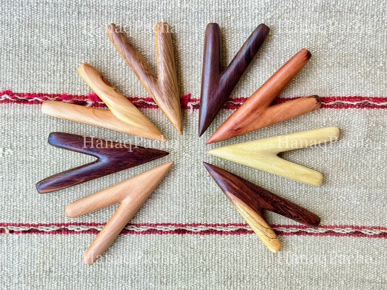 A selection of eight different styles of kuripe pipes, all hand carved from single blocks of wood. Clockwise: Classic Hardwood, Tamarind, Cemara, Teak, Dark Hardwood, Sawo, Crocodile and Two-Tone.
