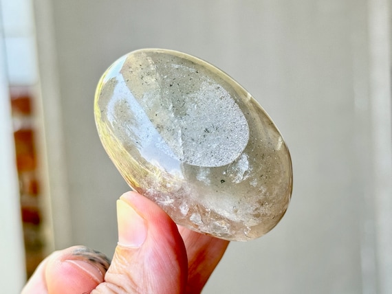 White Phantom Quartz Palm Stone with Ovular Kaolinite and Green Chlorite Inclusions, 110g, Minas Gerais, Brazil R298