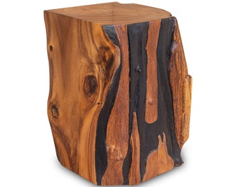 May include: A wooden stool with a natural brown finish and black streaks throughout the wood. The stool has a unique, irregular shape.