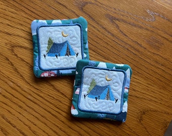 Adorable tent coasters. Machine embroidered. Great to use while camping or when you are at home dreaming of being camping.  Two coaster.