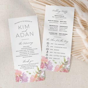 May include: Wedding ceremony program with a floral design. The program includes the order of events for the ceremony and reception. The names Kim and Adan are featured on the front of the program.