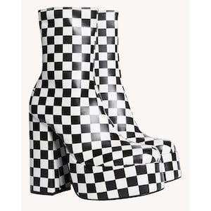 May include: A pair of platform ankle boots with a black and white checkerboard pattern. The boots have a chunky heel and a thick platform sole. The boots are made of a shiny material and have a rounded toe.