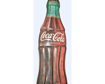 Botella vintage de Coca-Cola en lata con sabor a fruta, coleccionable.