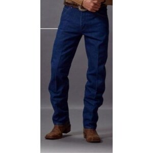 May include: Dark blue denim jeans with a classic fit. The jeans have a straight leg design and are paired with brown leather cowboy boots. The jeans are made of a durable denim material.