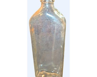 Botella de vidrio antigua con relieve Dr. Caldwell y corcho transparente