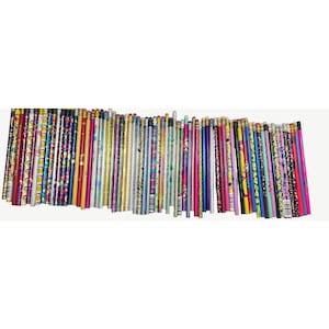 May include: A large collection of wooden pencils arranged in a horizontal row. Each pencil features a unique design, including various bright colors, metallic finishes, and diverse patterns such as polka dots, stripes, and geometric shapes.