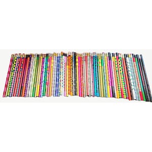 May include: A large collection of wooden pencils arranged in a row, featuring a wide variety of vibrant colors and diverse patterns including stripes, polka dots, zigzags, and geometric shapes, each topped with a small metal ferrule and eraser.