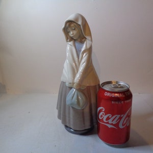 NAO by Lladro Girl on her travels with shawl and bundle