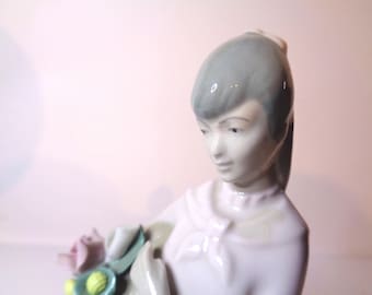 Spanish porcelain Girl with Flowers by M Requena