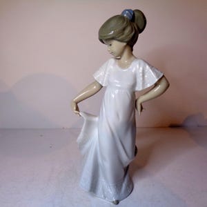NAO by Lladro Young Girl twirling in her lovely dress