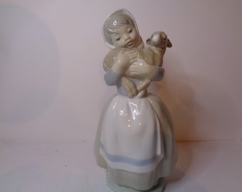 NAO by Lladro Young Girl carrying a lamb