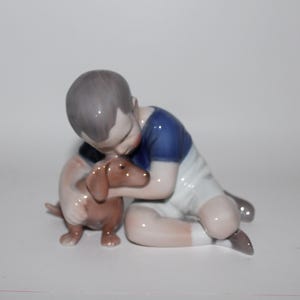 Royal Copenhagen Bing and Grondahl Boy with Dachshund No 1951