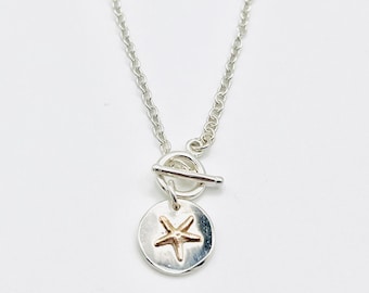 Silver starfish necklace.