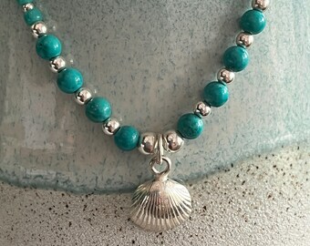 Turquoise beaded scallop necklace.