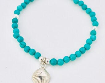 Turquoise beaded shell bracelet.