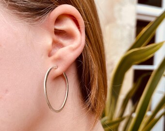 Large hammered hoops.