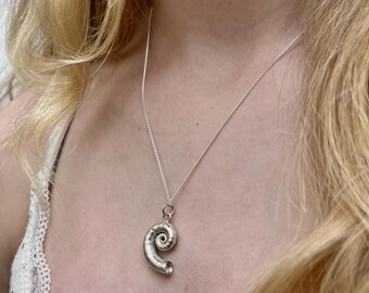 Large Silver spiral shell necklace.