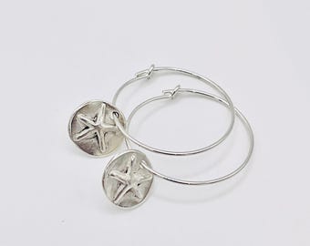 Silver Starfish disc hoops.