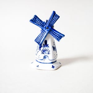 May include: A set of three ceramic mugs with a speckled, matte finish. The mugs are in shades of cream, light gray, and dark gray. Each mug has a simple, minimalist design, perfect for coffee or tea.