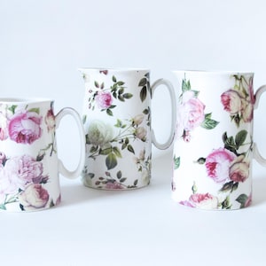 May include: A handmade wooden sign with the text "Welcome to our home" in a handwritten style. The sign is painted white with a distressed finish and a dark brown frame. It is designed for indoor or outdoor use.