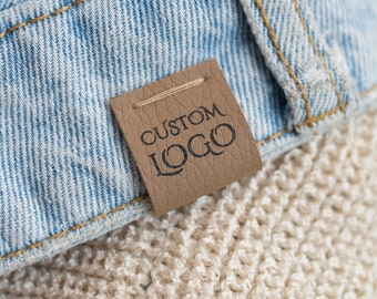 Customized faux leather clothing tags - Machine washable - We can use any of your designs.