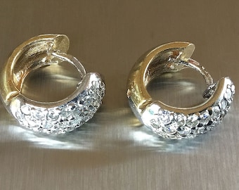 Diamond Pavé Huggie Hoop Earrings in 14K gold.
