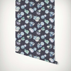 May include: A seamless pattern featuring blue and green crystals, moons, and celestial designs on a dark purple background.