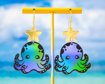 May include: A pair of iridescent green and purple octopus earrings with a gold starfish charm hanging from each earring.