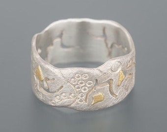 Silver ring with saw patterns and hallmarks