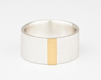 Silver ring with fine gold stripes