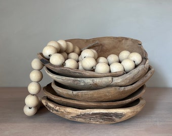 A large solid teak bowl