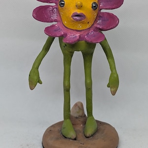 Gerber: low brow surrealist daisy sculpture.